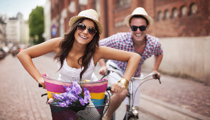 a woman and a man on a bicycle